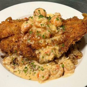 Stuffed Fish over Dirty Rice